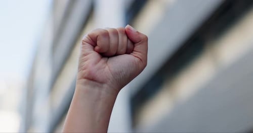 City, closeup and person with protest, fist and human rights with justice