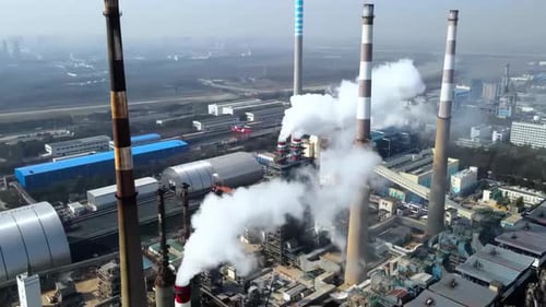 Close-up view smoked pipes of chemical enterprise plant. Air pollution concept. Industrial landscape