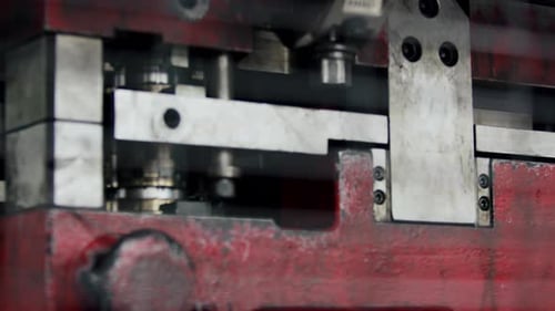 Slow motion of a big heavy hydraulic press shaping car products in the factory