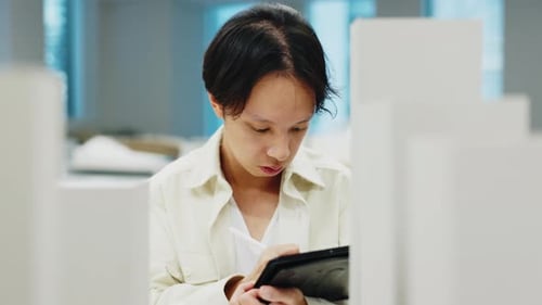 Man, tablet and architecture with building model of floor plan, inspection and renovation process