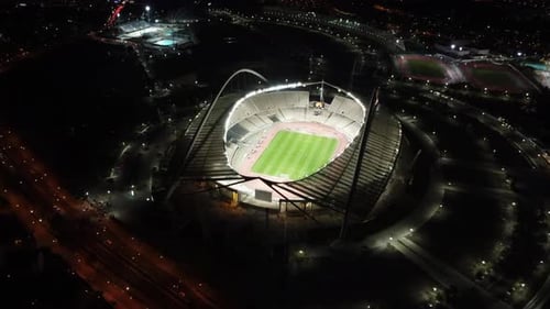 Aerial footage of an olympic stadium OAKA in Athens by Night