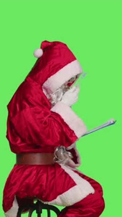 Vertical Video Profile of Man Santa Claus Write on Papers