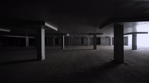 Dark Unfinished Underground Parking with Concrete Columns