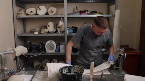 Medical Professional Smooths Bandages in a Laboratory