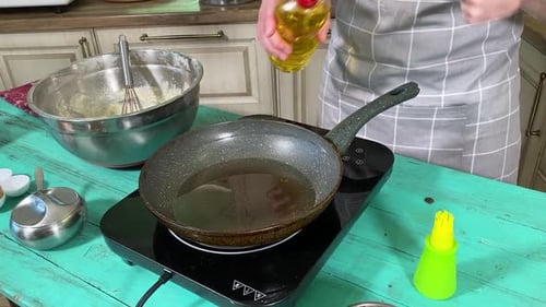 Frying Pancakes in a Pan at Home