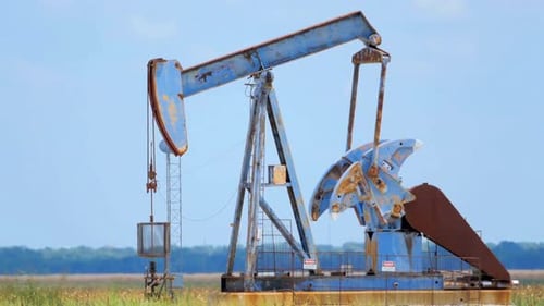 Pump Jack Operating in a Rural Field