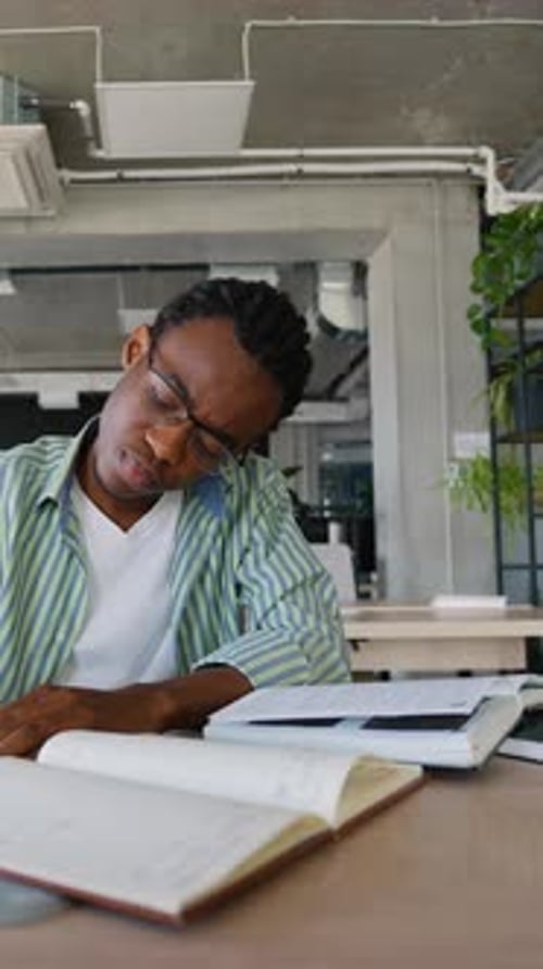 Focused African American Student Writing During Study