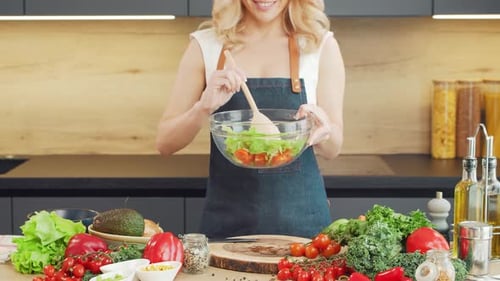 Woman Preparing Healthy Salad in Modern Kitchen
