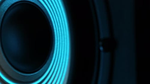 Macro Shoot Of Moving Of Music Speaker Playing Music In Blue Light