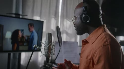 Man Recording Voiceover in Professional Audio Studio