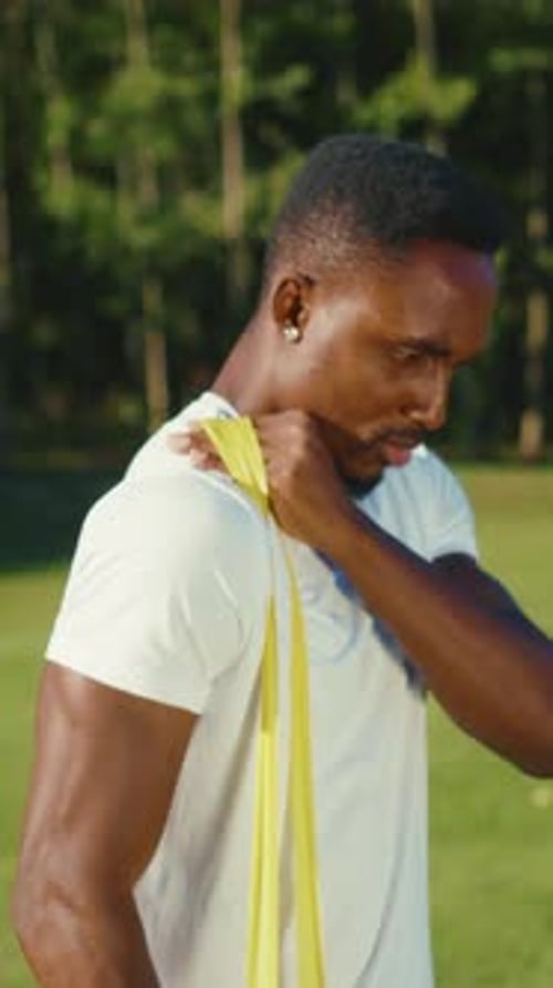 Man Stretching with Resistance Band Outdoors