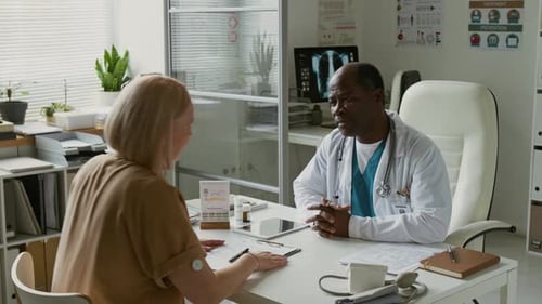 Doctor Consulting with Patient in Bright Office