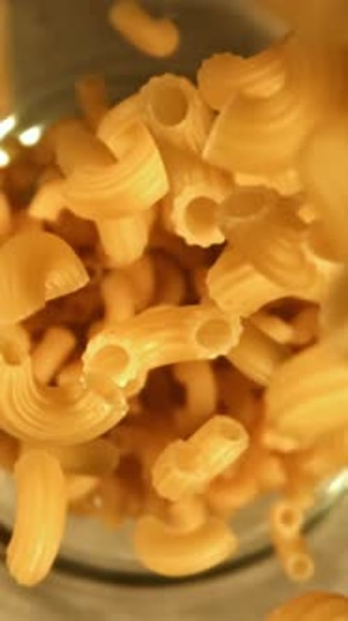 Super Slow Motion Dry Macaroni Pasta Filmed on a Highspeed Camera at 1000 Fps