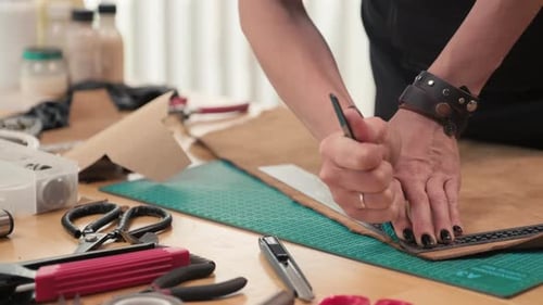 Leather Worker Cuts Along Line in Workshop