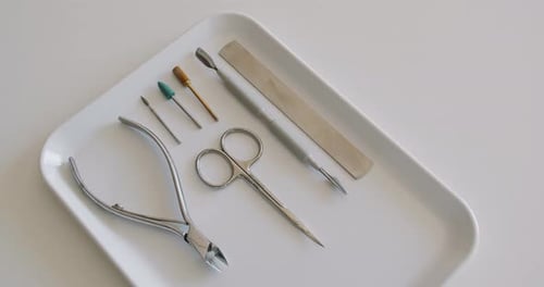Top View on Manicure Tools on Tray for Nail Care Procedure at Beauty Salon