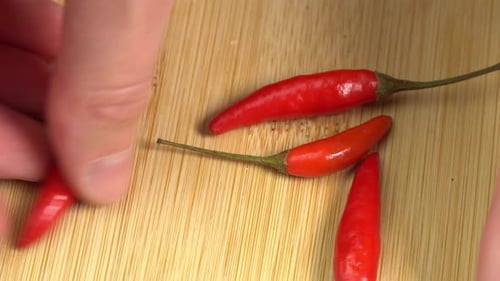 Bright Red Chili Peppers on Wooden Surface