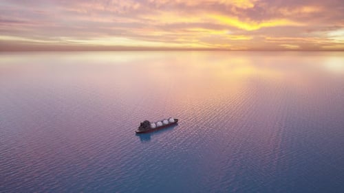 Large LNG Gas Carrier Ship Transporting Energy Resources Across the Ocean at Sunset