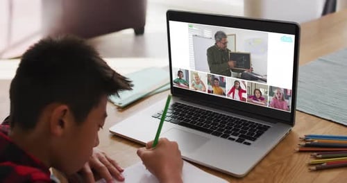 Boy Studying During Online Lesson on Laptop