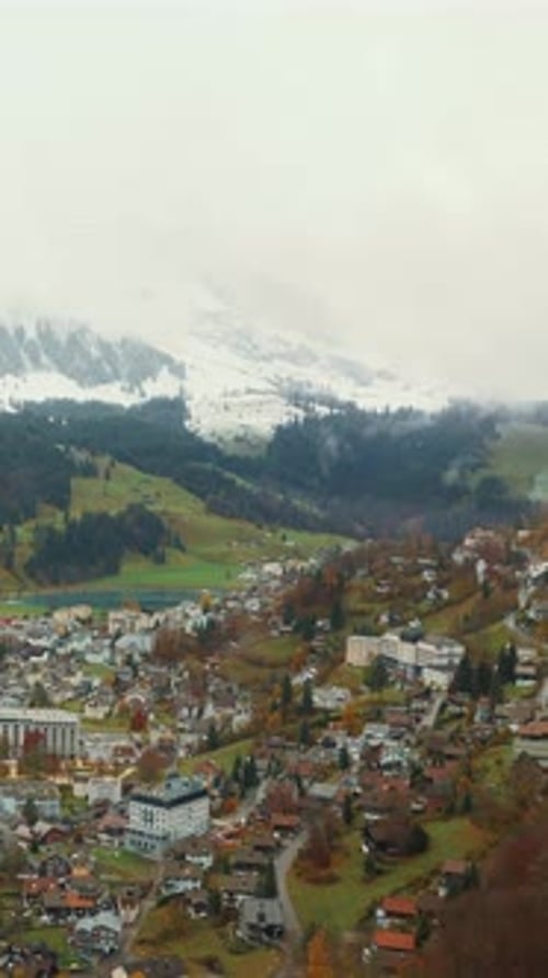 View from funicular on valley surrounded by Alps mountains. Vertical video
