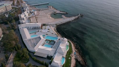 Top view of beautiful sea resort with spa center and sandy beach in the morning