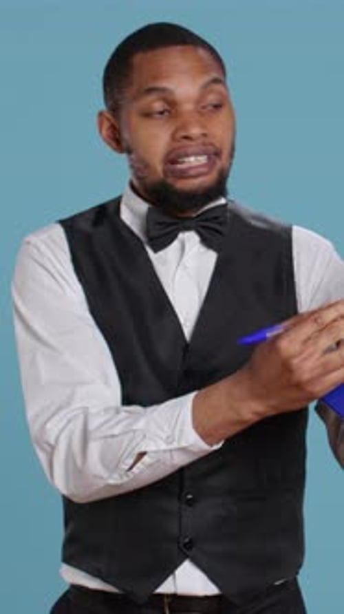 Vertical Video Hotel Concierge Showing the Check in Forms for Registration at Five Star Resort