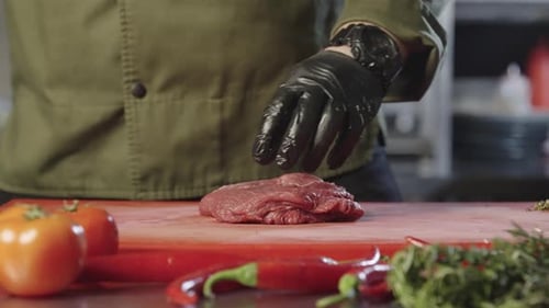 Chef Prepares Fresh Steak on Cutting Board