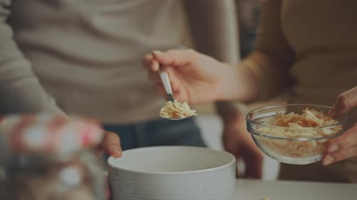 Woman poring cereals