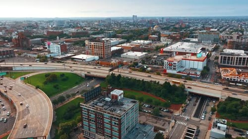 Daytime cityscape of Philadelphia, United States. Cars driving quickly by the wide highways.