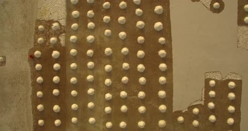 Traditional Salt flat in Madagascar, with heaps of Salt manually broken and collected, Aerial view