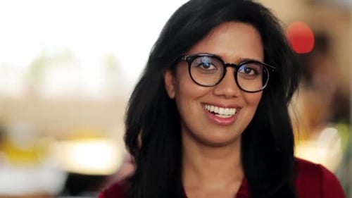 Smiling Young Woman Wearing Glasses Close Up
