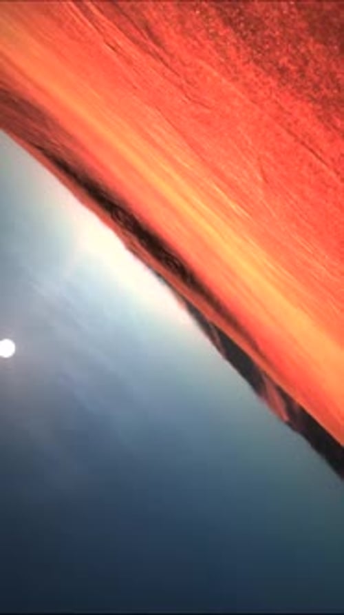 Dramatic Sunset Over Ocean with Bright Sun and Sky 01