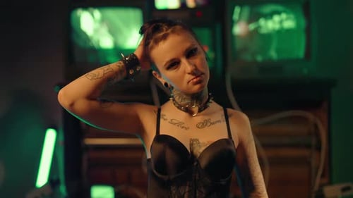 Smiling Young Adult Woman with Tattoos and Piercings