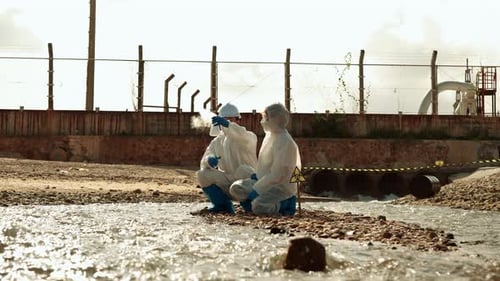 Scientists Collect Samples from Polluted Stream