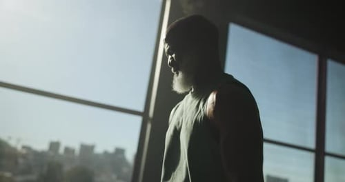 Exercise, man and dumbbells with weightlifting at gym for strength training, biceps growth or power