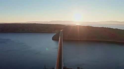 Drone shot of the bridge and ocean in the sunset 1