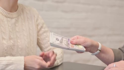 Close up of Woman Giving Money