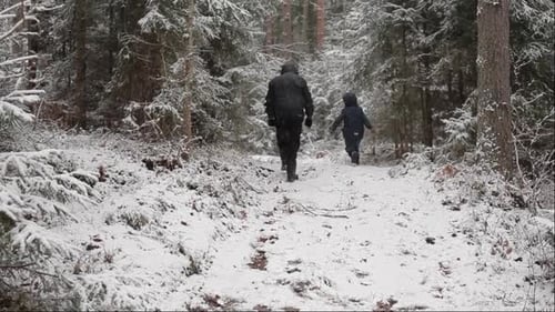 The children walked alone along the forest path in winter