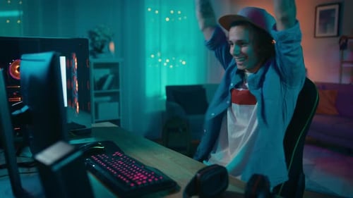 Excited Man Playing Video Games at Home