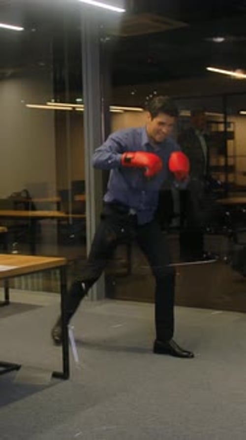 Vertical of Businessman Ready to Fight for Job