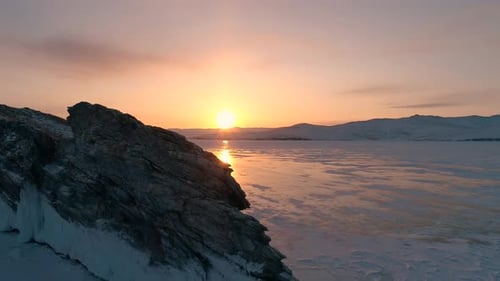 Aerial Over the Rocky Island in Lake Baikal Winter Landscape of Frozen Baikal at Beautiful Lilac