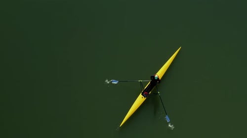 Aerial view of a crew boat rowing on a lake