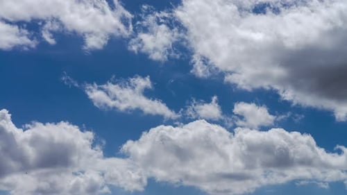 Time lapse of moving clouds with a blue sky on a summer day