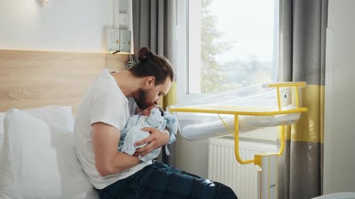 Handsome Dad Carrying His Newborn Baby in Postnatal Department Happy Fathers