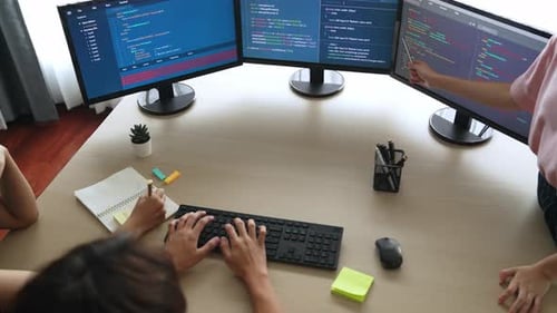 Slow motion back end software developer engineer writing code. Burgeoning