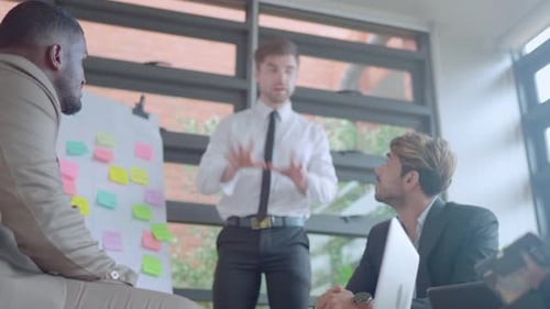 Business manager and team with multiethnic discuss in meeting area using board and want success