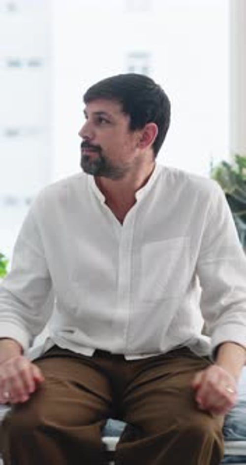 Man, worry and nervous on hospital bed for consultation, thinking or waiting for medical results