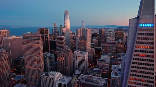 Aerial upward rising elevation video that reveals the view of a develped city