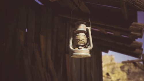 Softly Glowing Lantern Contrasts with Rugged Landscape in Cinematic Style