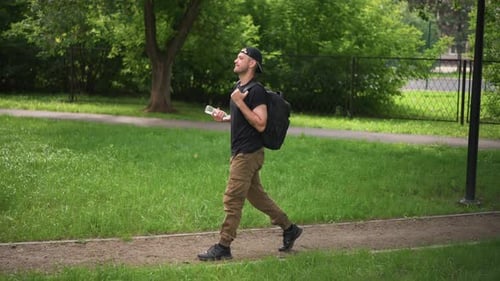 Male Strolling Outdoors Man Enjoying Music Walk Gentleman Moving Through Park Listening Male Figure