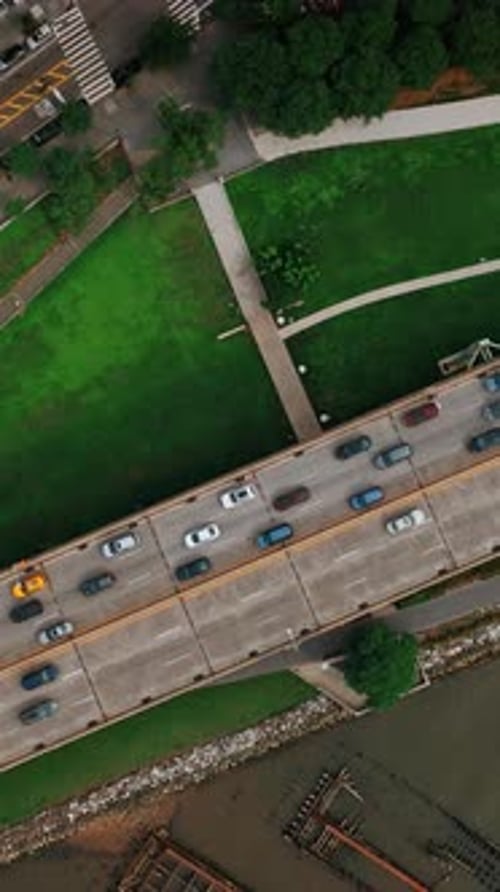 View of the two-way road with multiple cars moving by. One of the highways in New York from top